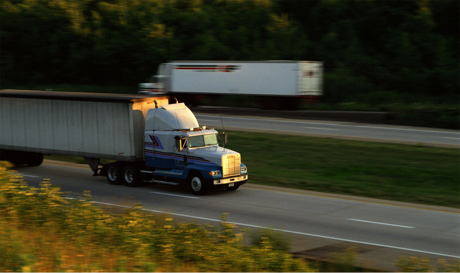 trucks on highway going in opposite directions